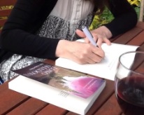 Julie signing book